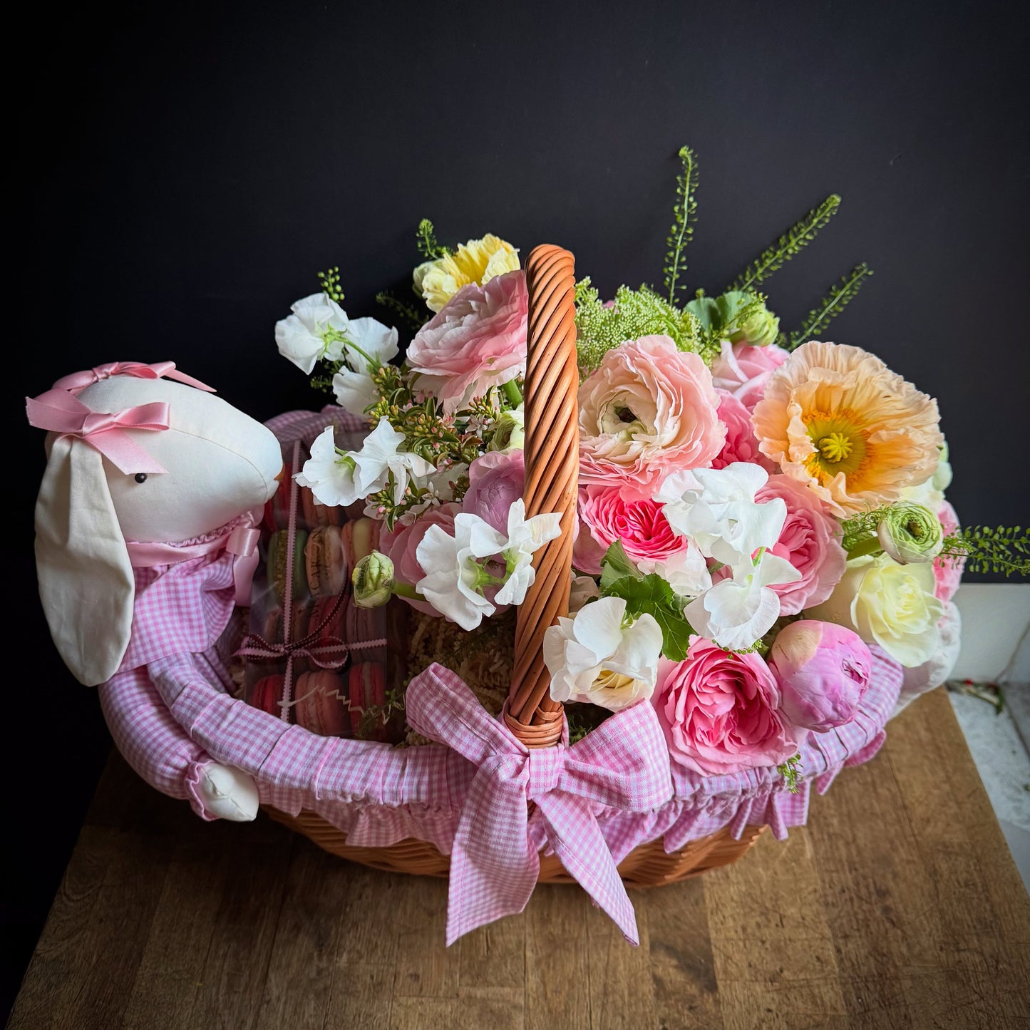 Gift Basket With Flowers — pink gingham basket with poppies, ranunculus, sweet peas, and plush bunny — same-day delivery Manhattan, NYC