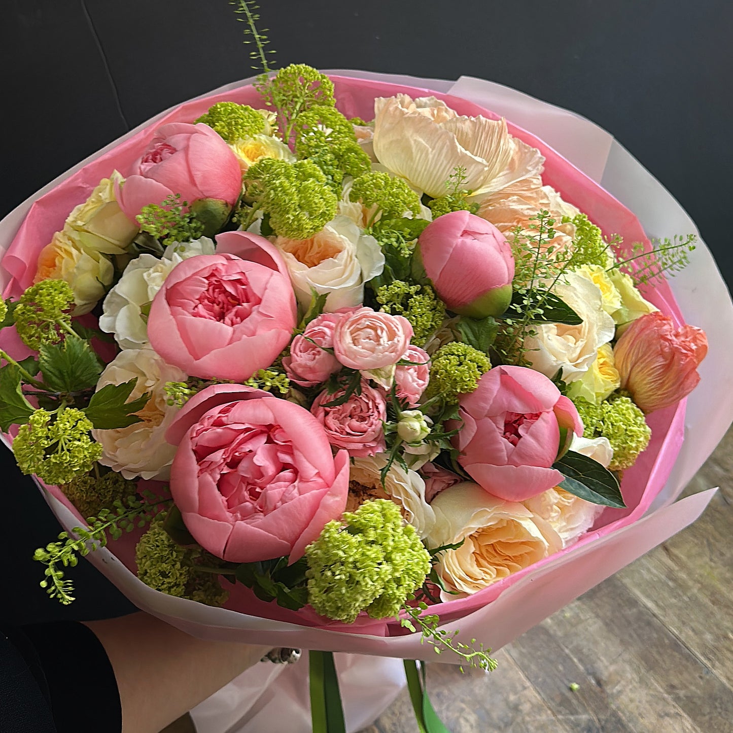 Gaia bouquet — pink peonies, blush ranunculus, and peach parrot tulips with green viburnum — same-day delivery Manhattan, NYC