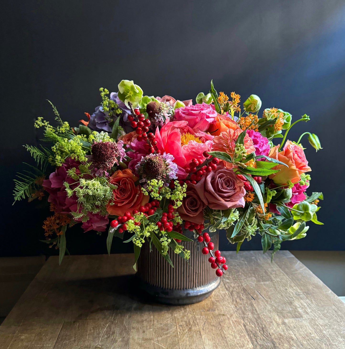 Jewel floral arrangement with coral peonies, roses, and greenery by Alaric Flower Design NYC